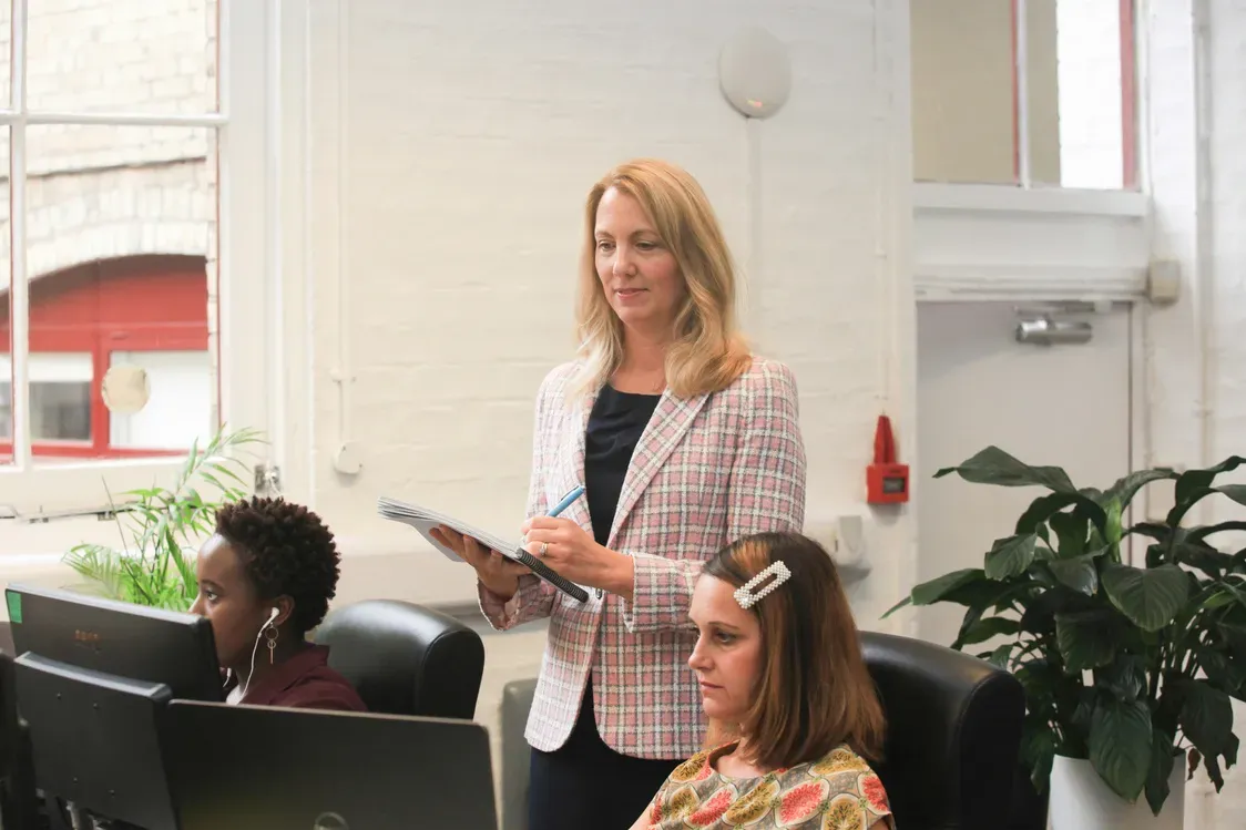 Nichola Adams observing colleagues at their workstations